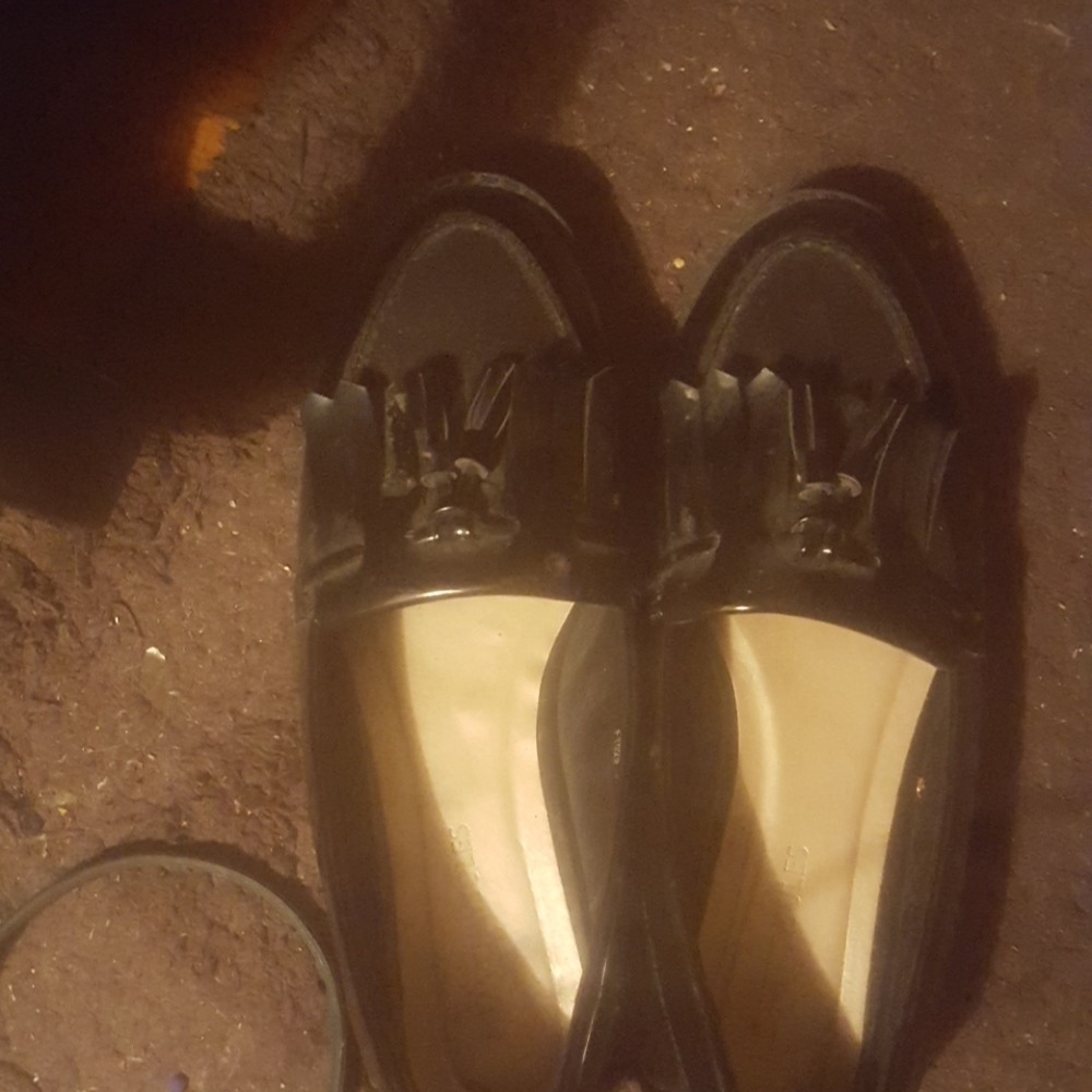 Black loafers .